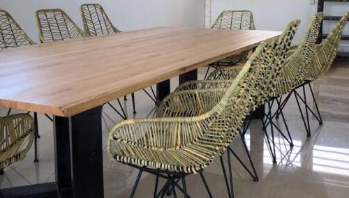 Meeting room table with rotin chairs by Inwood